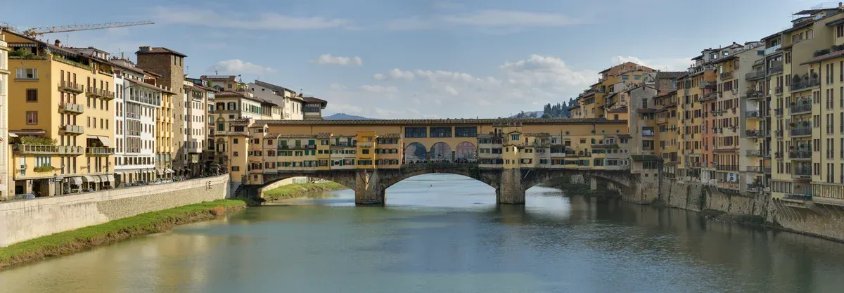 The Ponte Vecchio and its overhanging shops across the Arno in Florence, a stop on most tours from Rome to Florence