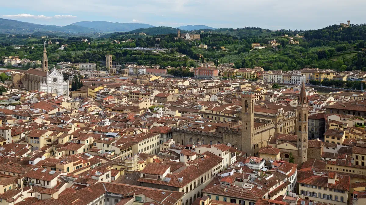 Red roofs of Florence toward Piazza della Signoria and Santa Croce seen from Giotto's Bell Tower, seen on a Florence in one day tour from Rome